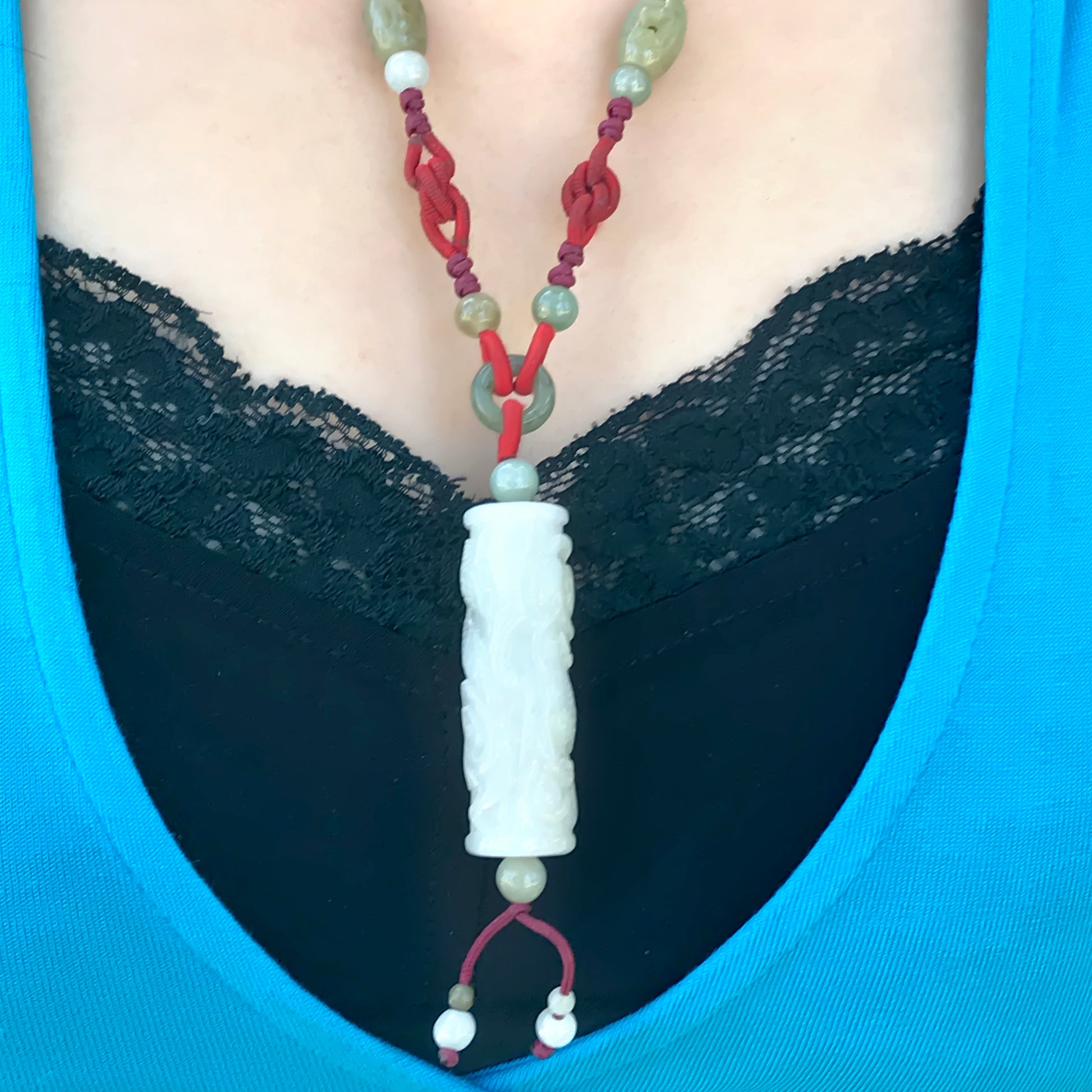 Shine with this Remarkable Masterpiece Dragon Handcrafted Jade Necklace made with Red Cord