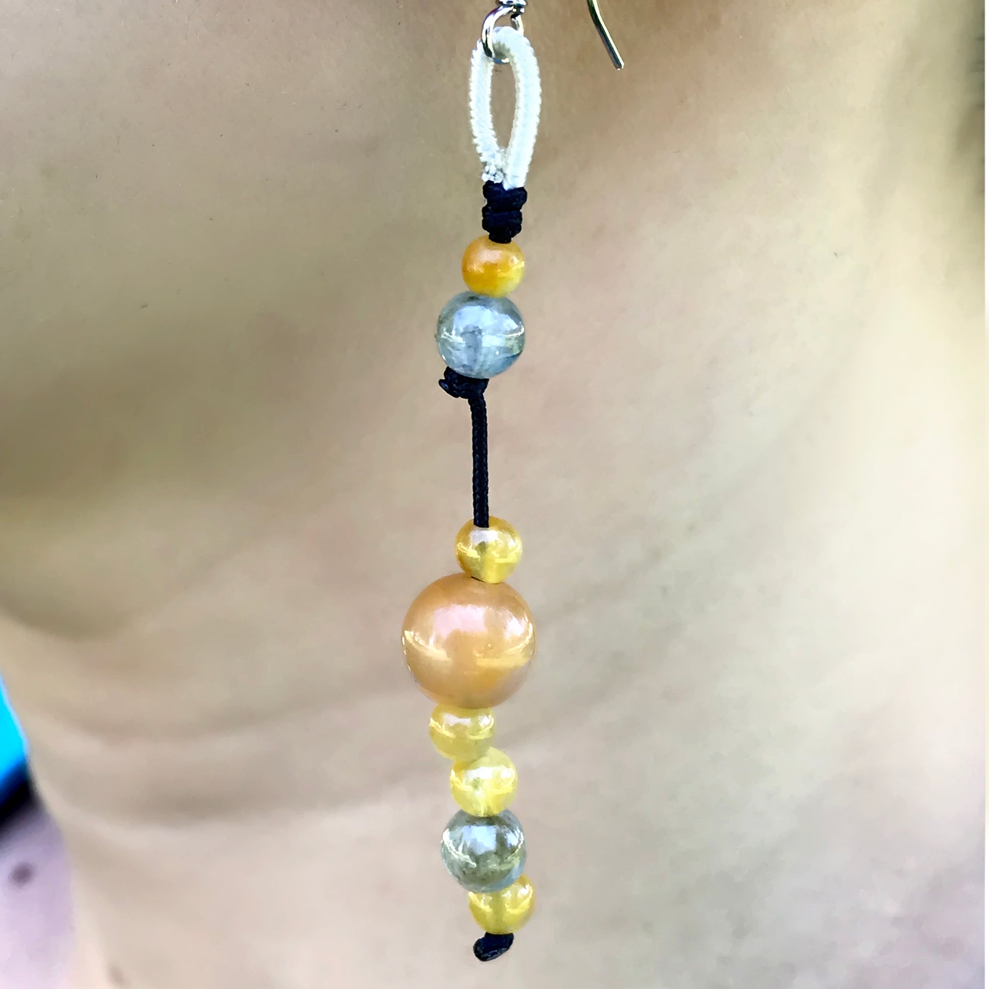 Make a Bold Statement with Honey Jade Beads Thread Earrings made with Black Cord